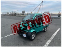 a white truck with a sold sign on it