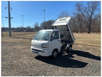 a white truck with a sold sign on it
