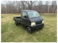 a white truck with a sold sign on it