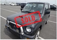 a white truck with a sold sign on it