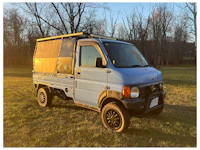 a white truck with a sold sign on it
