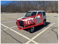 a white truck with a sold sign on it