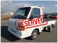 a white truck with a sold sign on it