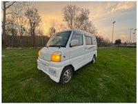 a white truck with a sold sign on it
