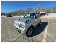 a white truck with a sold sign on it