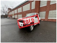 a white truck with a sold sign on it